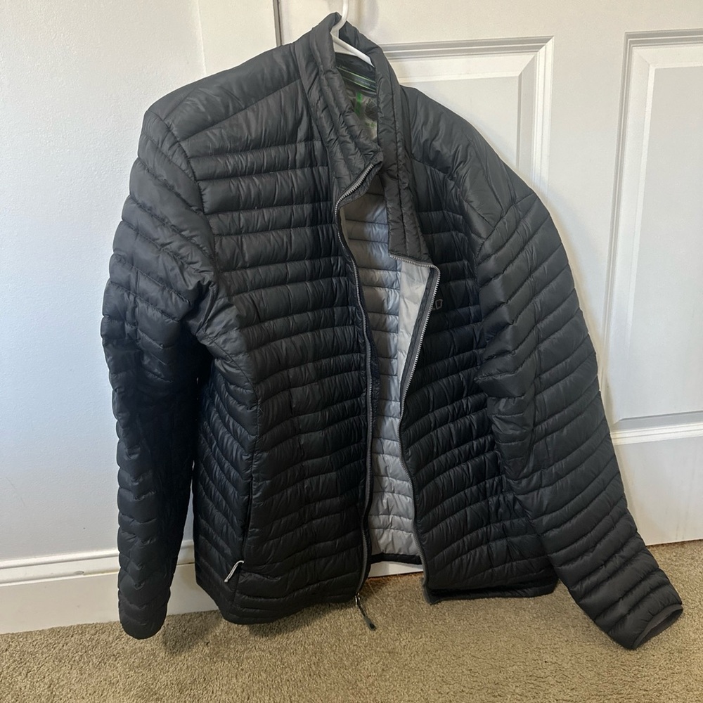 This stylish black jacket is a must-have for any fashionable man.